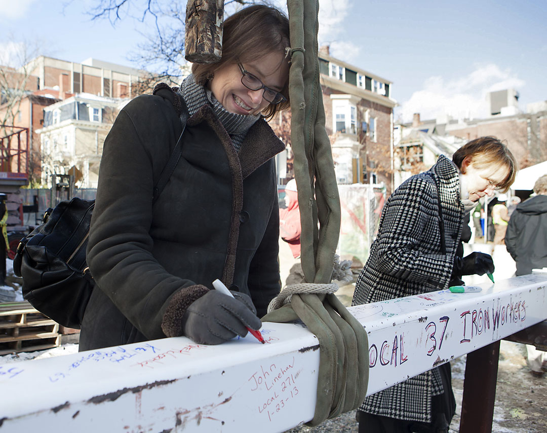 A happy, very cold day: President Paxson adds her signature to the final beam at the topping-off ceremony for the new environmental building. Photos by Mike Cohea/Brown University A happy, very cold day: President Paxson adds her signature to the final beam at the topping-off ceremony for the new environmental building. Photos by Mike Cohea/Brown University