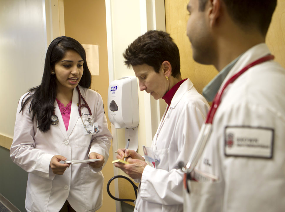 It’s so uplifting “to have young people so interested in primary care”: First-year medical student Sanchita Singal presents information from an exam she has conducted to Dr. Caroline Troise, medical director of the Rhode Island Free Clinic. At the clinic, Troise says, students get to practice primary care as it’s supposed to be. It’s so uplifting “to have young people so interested in primary care”: First-year medical student Sanchita Singal presents information from an exam she has conducted to Dr. Caroline Troise, medical director of the Rhode Island Free Clinic. At the clinic, Troise says, students get to practice primary care as it’s supposed to be.
