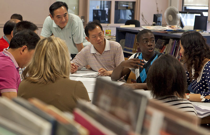 This is how we do it here: Esek Hopkins eighth-grader Komotay Koffie, 14, answers questions from visiting Chinese administrators and educators through a translator.Credit: Mike Cohea/Brown University This is how we do it here: Esek Hopkins eighth-grader Komotay Koffie, 14, answers questions from visiting Chinese administrators and educators through a translator.Credit: Mike Cohea/Brown University