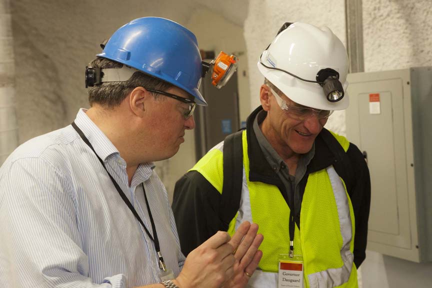 Deep background: Rick Gaitskell explains the experiment to South Dakota Gov. Dennis Daugaard during a dedication ceremony 4,850 feet underground in the Sanford Underground Research Facility. Credit: Steve Babbitt/Black Hills State University Deep background: Rick Gaitskell explains the experiment to South Dakota Gov. Dennis Daugaard during a dedication ceremony 4,850 feet underground in the Sanford Underground Research Facility. Credit: Steve Babbitt/Black Hills State University