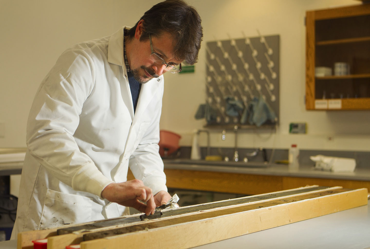 A 60,000-year meterological record: Jim Russell prepares a specimen from a Lake Towuti sedimentary core for analysis. It’s estimated that Lake Tuwuti sediments have recorded up to 800,000 years of climate data. Credit: Mike Cohea/Brown University A 60,000-year meterological record: Jim Russell prepares a specimen from a Lake Towuti sedimentary core for analysis. It’s estimated that Lake Tuwuti sediments have recorded up to 800,000 years of climate data. Credit: Mike Cohea/Brown University