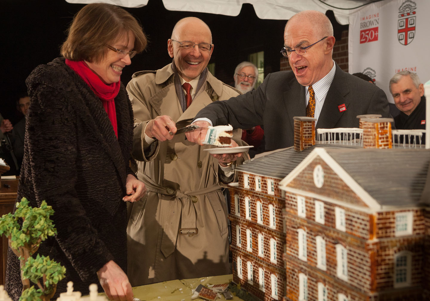 The first slice: After toasts by Sen. Jack Reed and Reps. Jim Langevin and David Cicilline, President Christina Paxson, Vice Chancellor Jerome Vascellaro, and Chancellor Thomas Tisch did the honors. Credit: Frank Mullin/Brown University The first slice: After toasts by Sen. Jack Reed and Reps. Jim Langevin and David Cicilline, President Christina Paxson, Vice Chancellor Jerome Vascellaro, and Chancellor Thomas Tisch did the honors. Credit: Frank Mullin/Brown University
