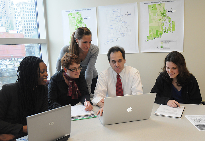 Mapmakers: Patrick Vivier and students in community health plotted lead poisoning, pre-1950 housing stock, and low-income households to help target cleanup resources. (Credit: Frank Mullin / Brown University) Mapmakers: Patrick Vivier and students in community health plotted lead poisoning, pre-1950 housing stock, and low-income households to help target cleanup resources. (Credit: Frank Mullin / Brown University)