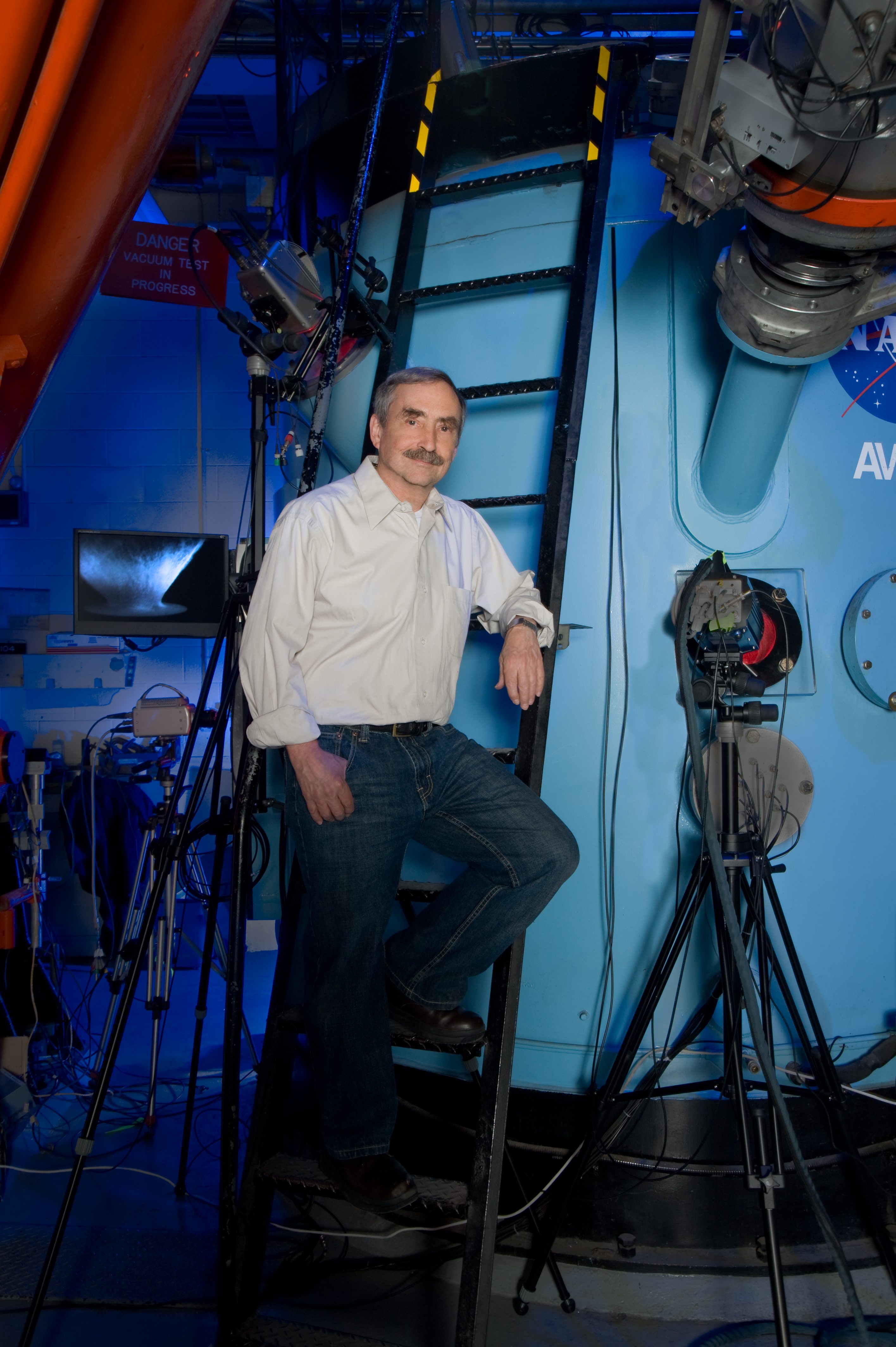 Jumping: Peter Schultz stands in front of the Vertical Gun Range at the NASA Ames Research Center Jumping: Peter Schultz stands in front of the Vertical Gun Range at the NASA Ames Research Center