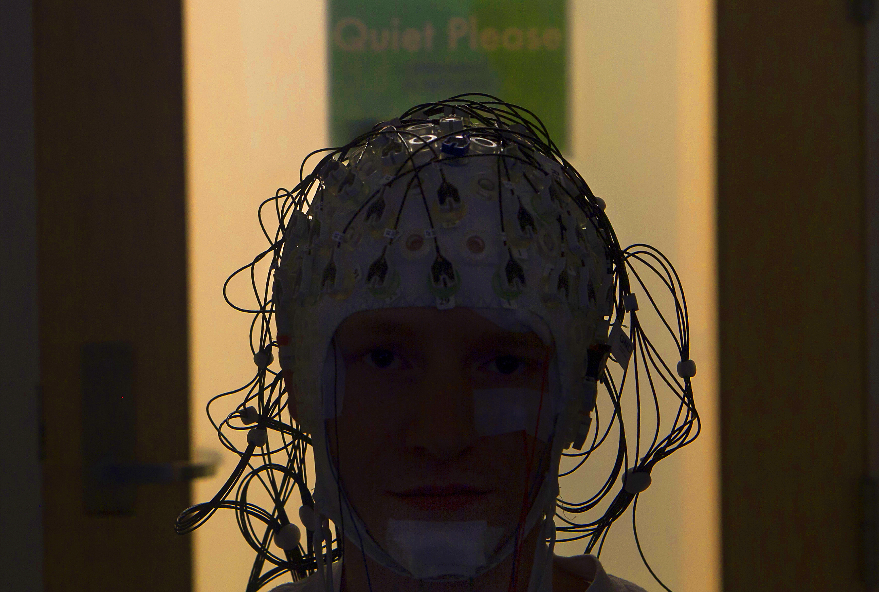 Cap of Sensors: In a sleep lab on Brown's campus researchers use now using caps of EEG sensors in studies of how the brain works to consolidate learning visual tasks. Here graduate student Aaron Berard models the cap. Cap of Sensors: In a sleep lab on Brown's campus researchers use now using caps of EEG sensors in studies of how the brain works to consolidate learning visual tasks. Here graduate student Aaron Berard models the cap.