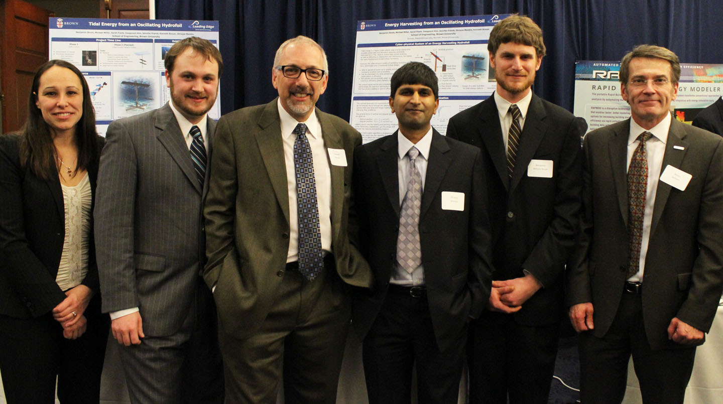 The hydrofoil team presents findings in Washington, D.C.: From left: Jennifer Franck, lecturer in engineering; Michael James Miller, grad student; Kenneth Breuer, professor of engineering; Shreyas Mandre, professor of engineering and team leader; Benjamin Strom, research engineer; and Bryan Willson, a program director at the Advanced Research Projects Agency-Energy (ARPA-E). The hydrofoil team presents findings in Washington, D.C.: From left: Jennifer Franck, lecturer in engineering; Michael James Miller, grad student; Kenneth Breuer, professor of engineering; Shreyas Mandre, professor of engineering and team leader; Benjamin Strom, research engineer; and Bryan Willson, a program director at the Advanced Research Projects Agency-Energy (ARPA-E).